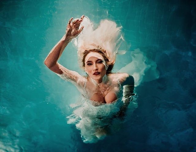 Underwater bridal portrait with hair and fabric floating upward