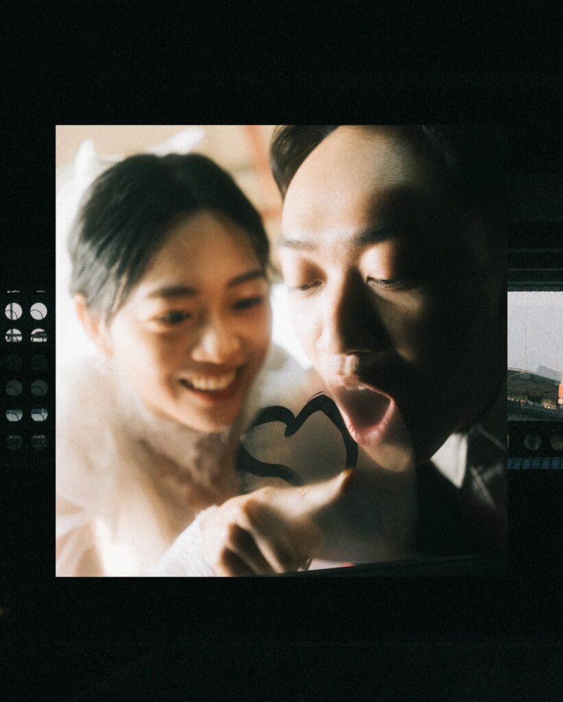 Printed couple portrait presented over a monochrome contact-sheet style background