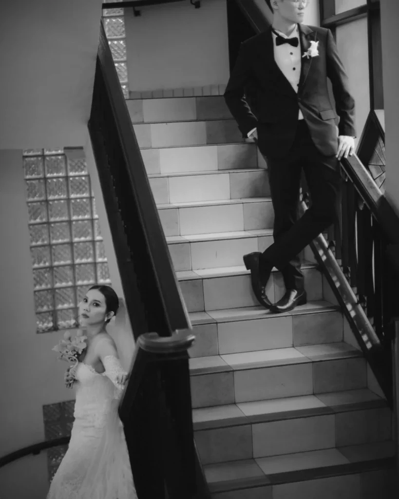 Black and white couple portrait arranged on different levels of a staircase