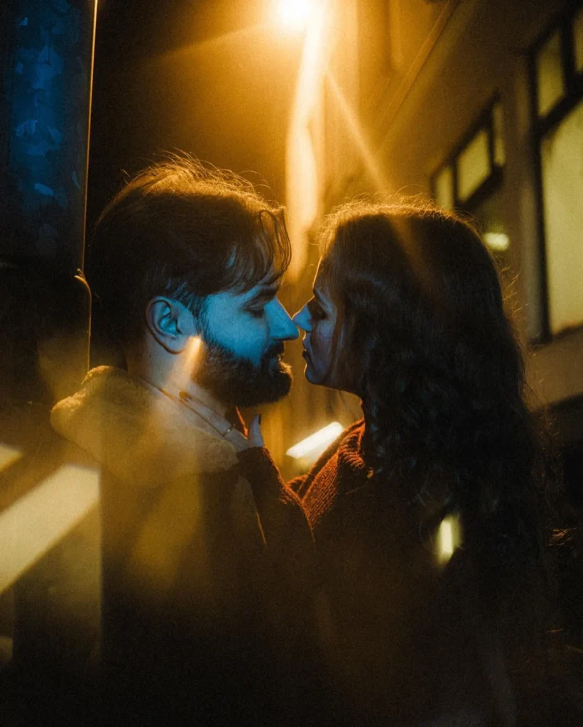 Couple facing each other on a street beneath warm golden light